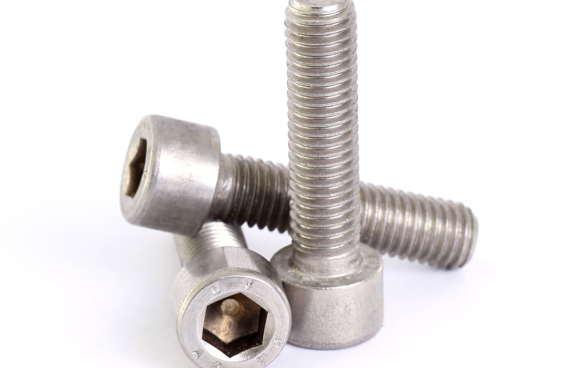 High tensile machine bolt manufactured by Dalloyed in a construction setting.